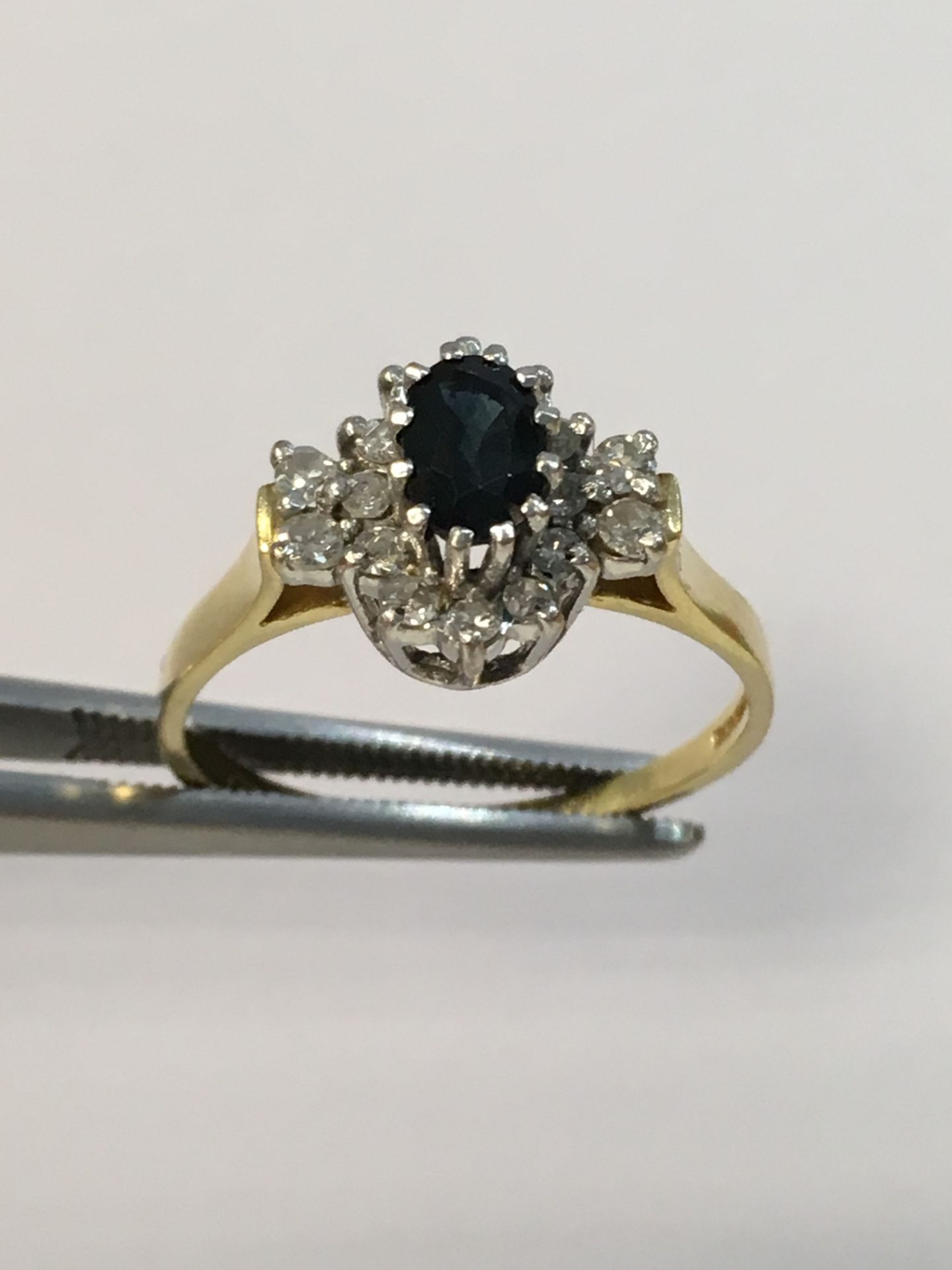 10K Yellow Gold Ring with Saphire and 0.18ct Cluster Diamonds