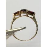 10K Yellow Gold ring with 3 Garnet Stones TW: 10ct