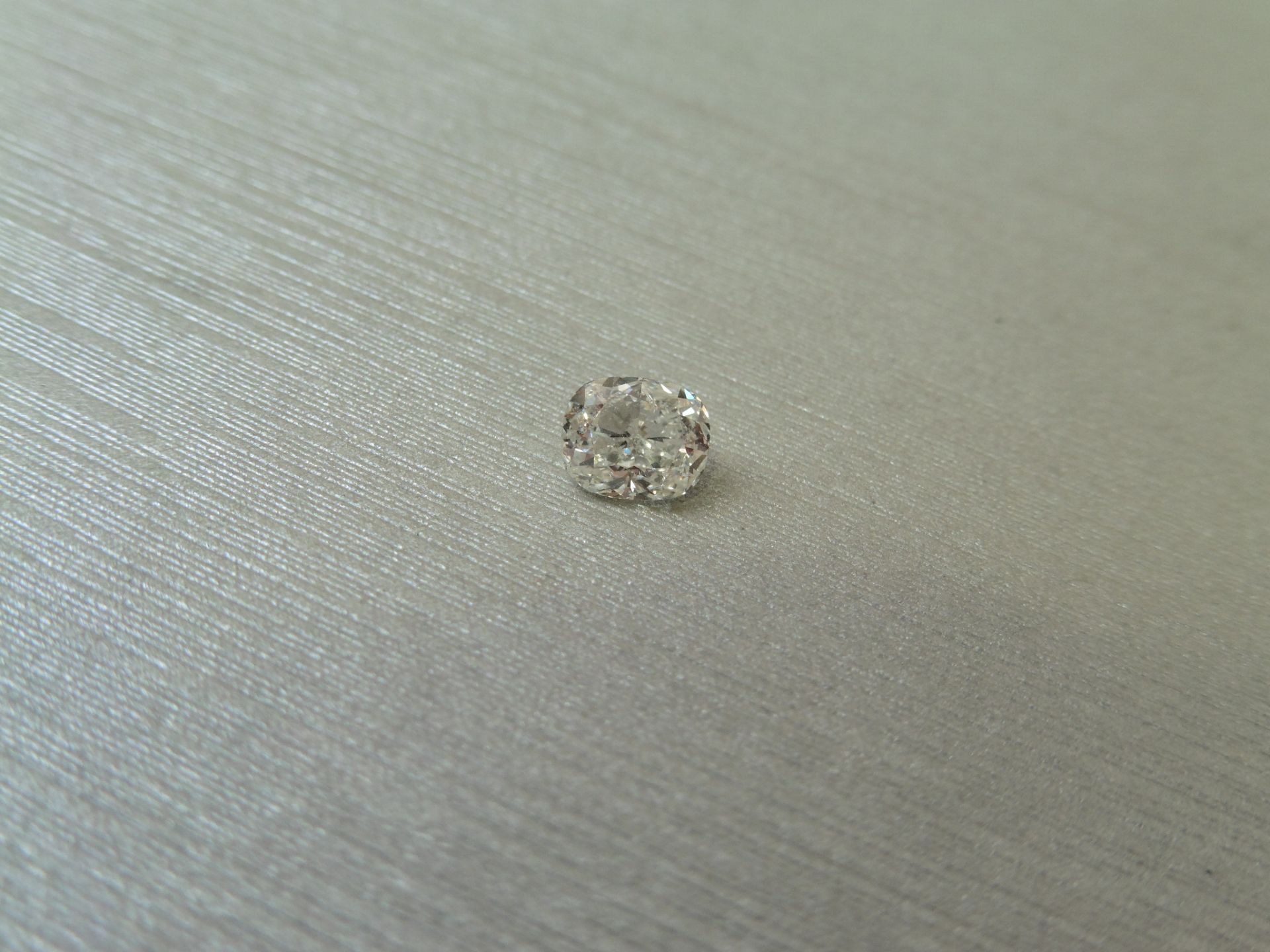 1.50ct single cushion cut diamond. Measurements 6.48 x 6.36 x 4.44mm. J colour and Si1 clarity.