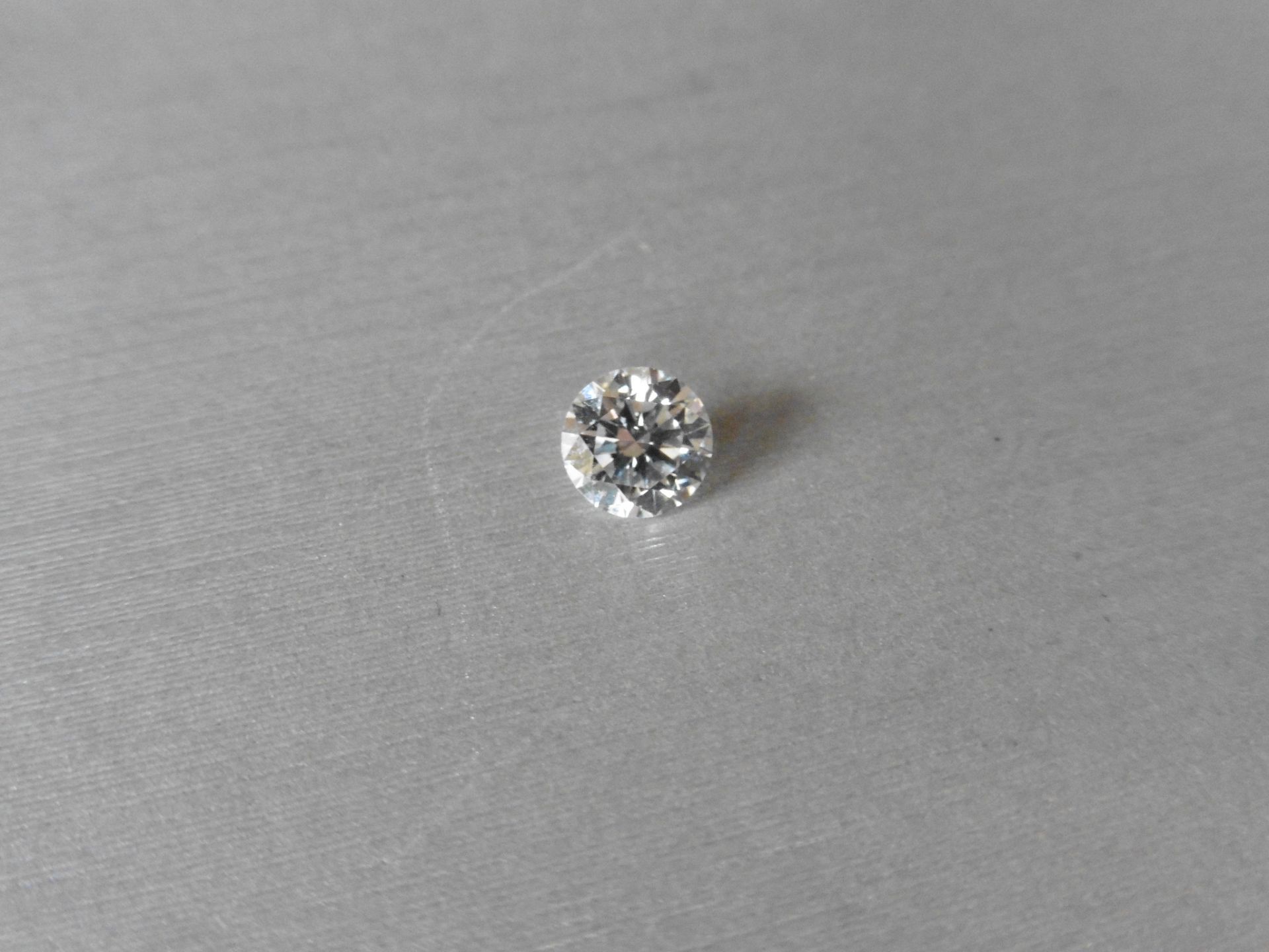 1.07ct single brilliant cut diamond, H colour SI1 clarity. 6.54 mm x 6.58mm x 4.01mm. Suitable for