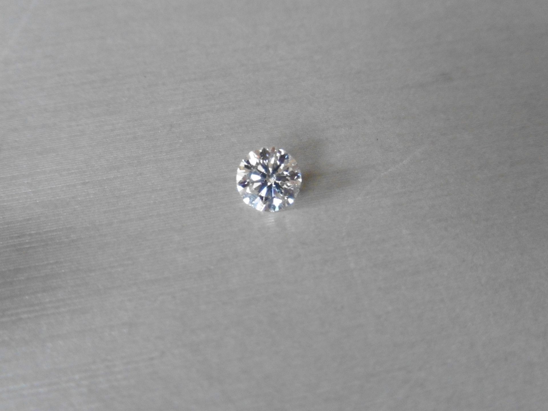 1.06ct single brilliant cut diamond, H colour SI1 clarity. 6.51mm x 6.55mm x 4.05mm. Suitable for