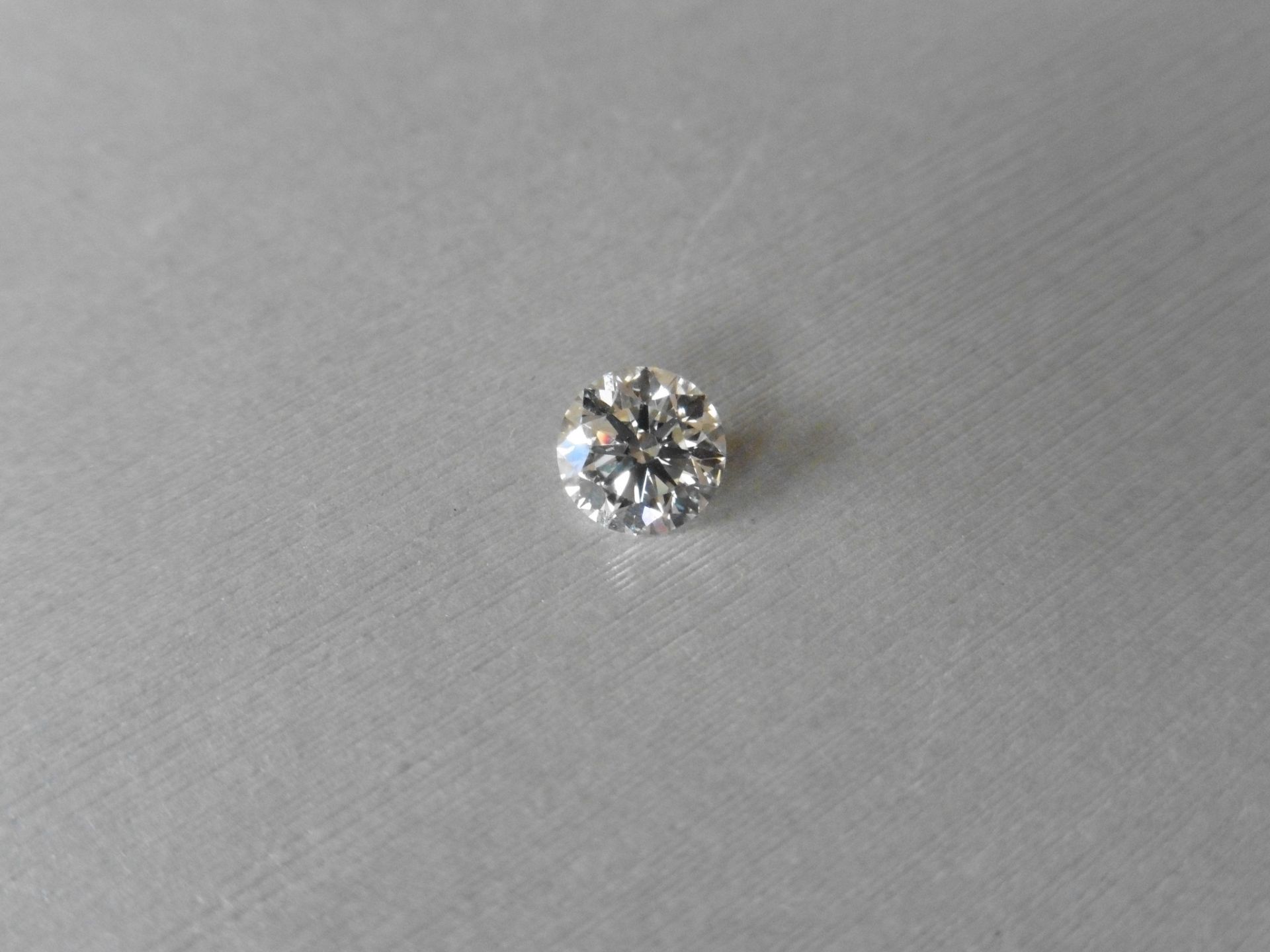 1.21ct single brilliant cut diamond, K colour VS2 clarity. 6.79 mm x 6.81mm x 4.22mm. Suitable for
