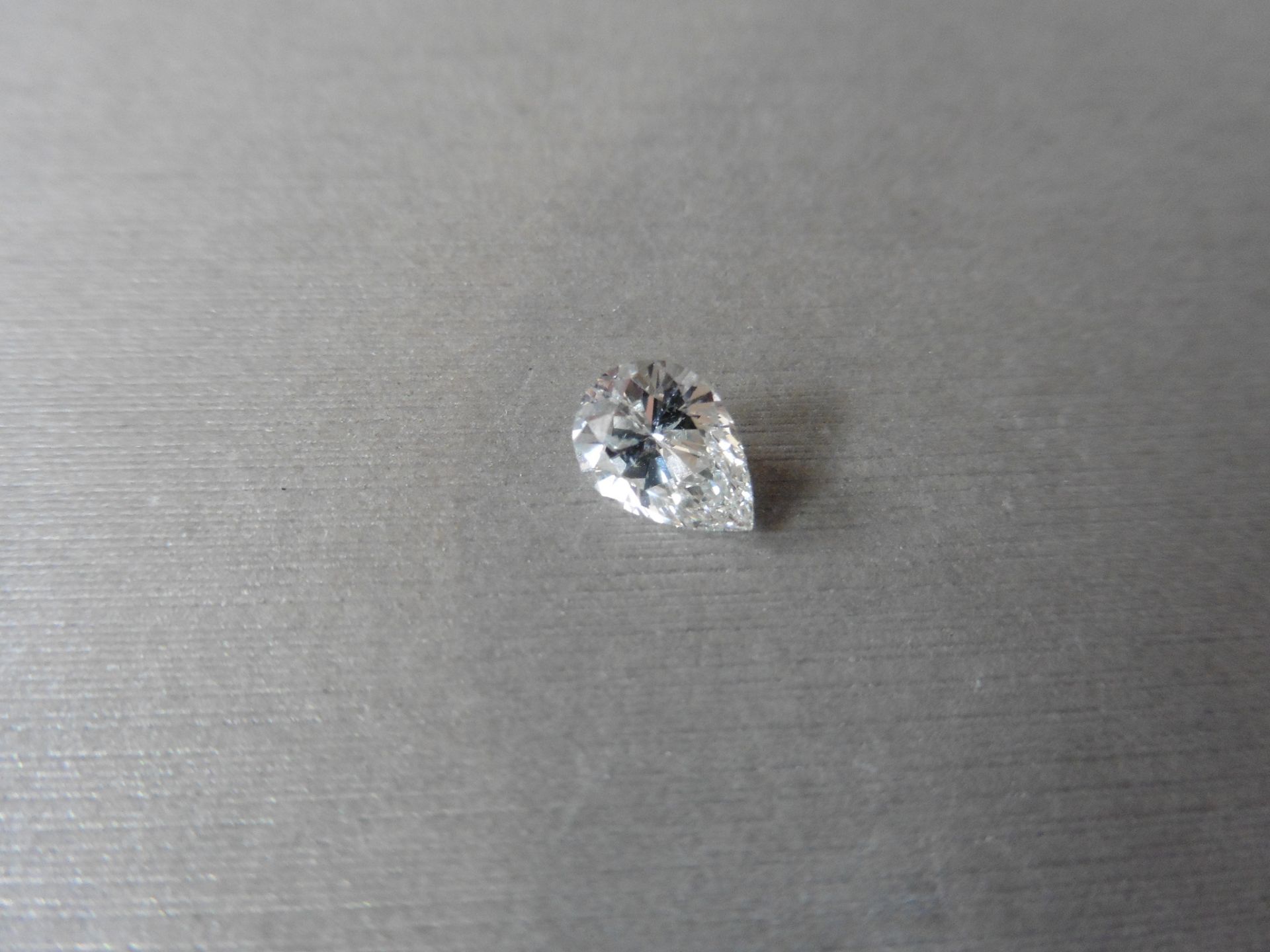 1.01ct single pear shaped diamond. Measures 8.18 x 5.82 x 3.78mm. H Colour, SI2 clarity. No