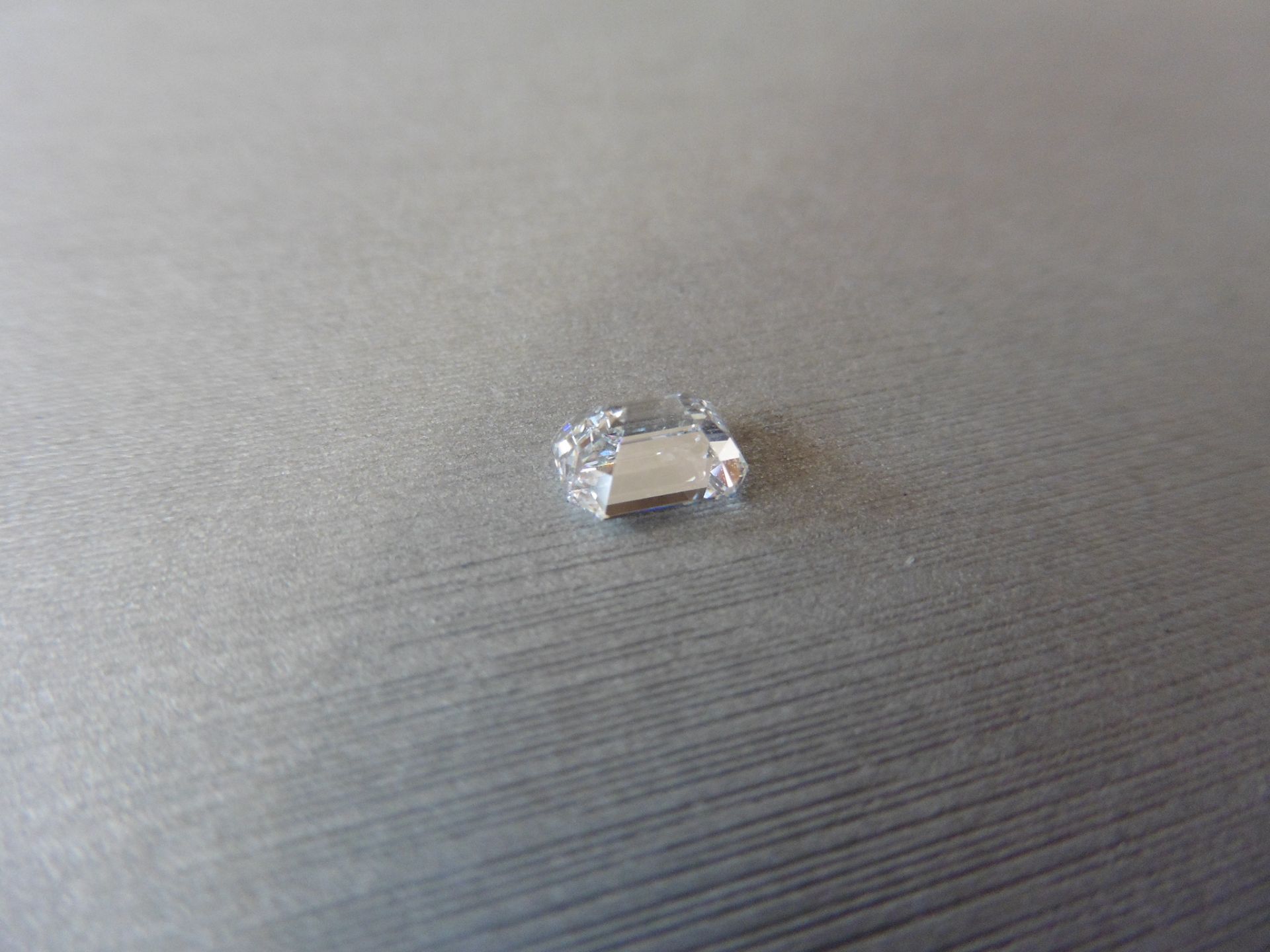 1.28ct single emerald cut diamond, E colour VVS2 clarity. 7.16 x 5.31 x 3.60. Suitable for - Image 2 of 5