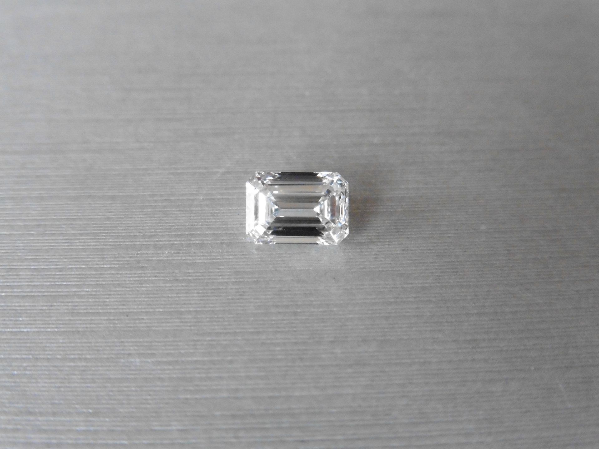 2.00ct single emerald cut diamond. Measures 8.46 x 6.01 x 3.94mm. E colour VS1 clarity. Valued at £