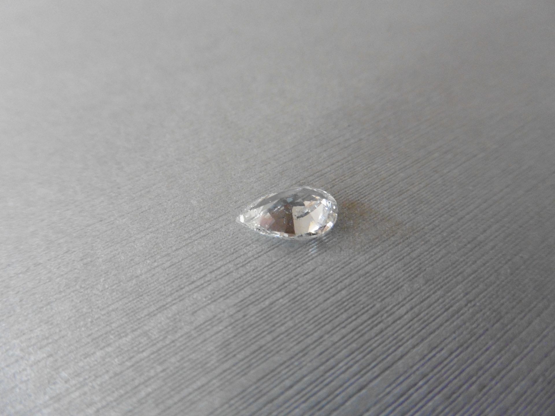 1.70ct single pear cut diamond H colour S12 clarity. 9.96 x 6.66 x 4.09. Suitable for mounting in - Image 2 of 5