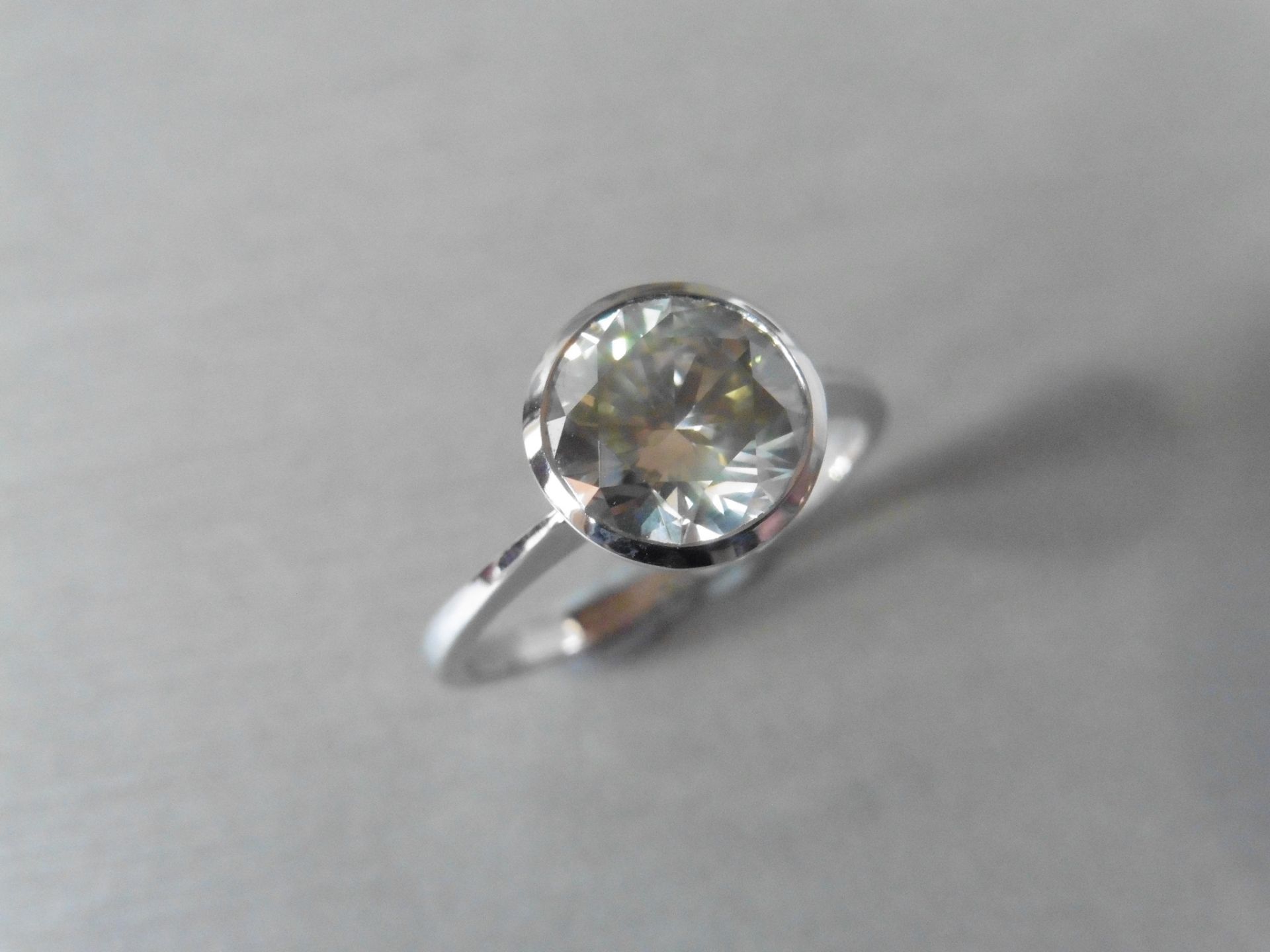 2.36ct brilliant cut diamond solitaire ring. L Colour and SI2 clarity. Rub over setting to secure