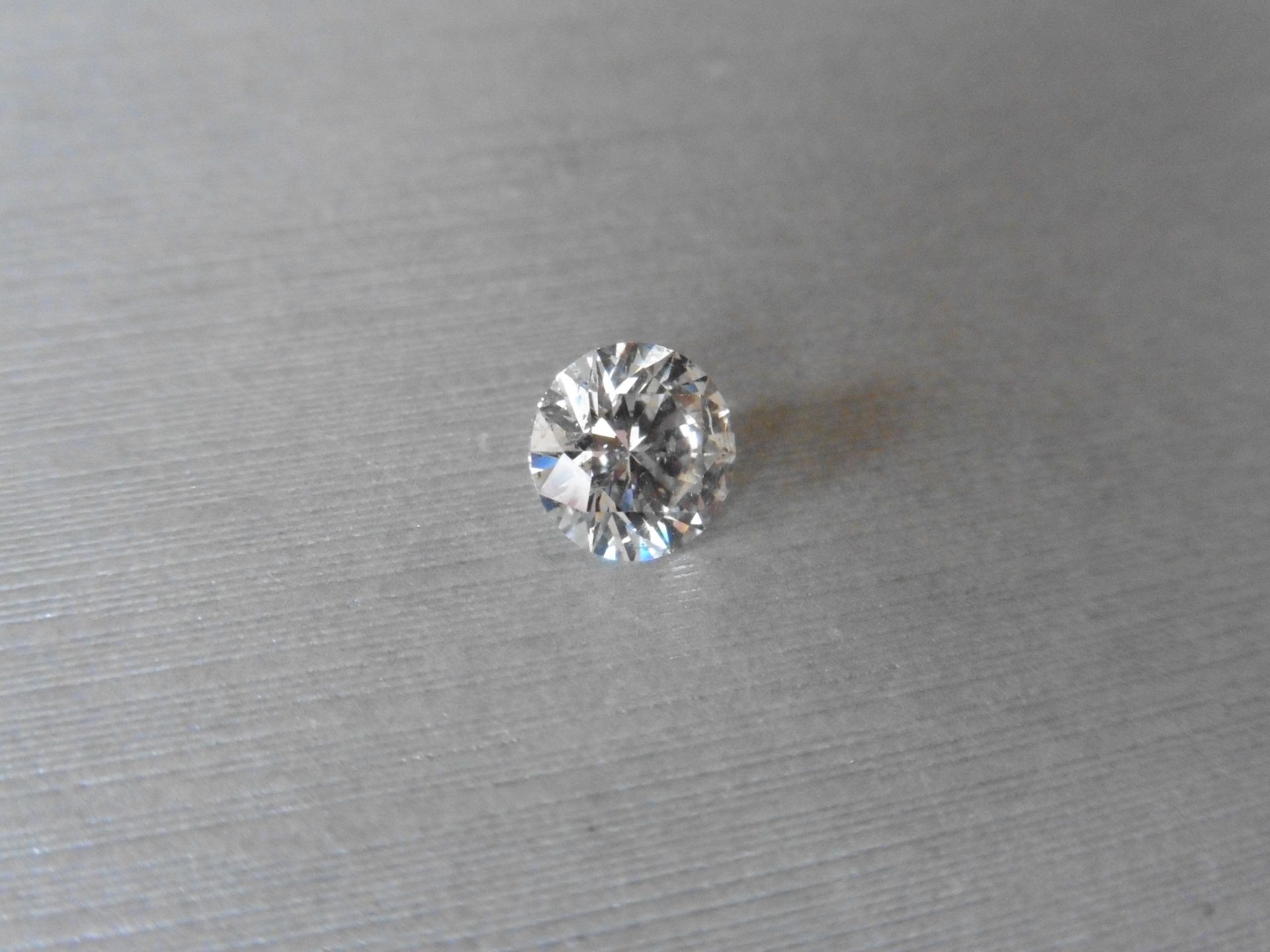 1.72ct single brilliant cut diamond. Measures 7.71 x 7.74 x 4.72mm. H colour, si2 clarity. Valued at