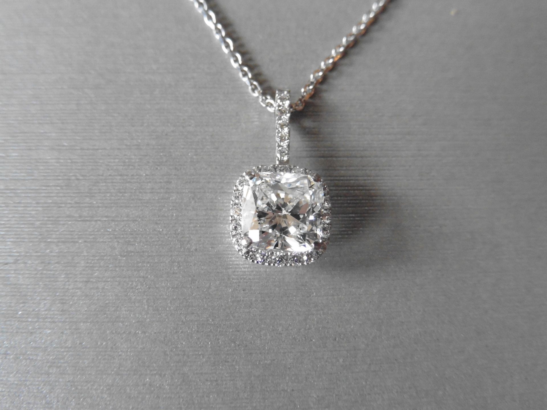 18ct white gold diamond set pendant. Set with a 1.95ct cushion cut diamond, F colour si2 clarity