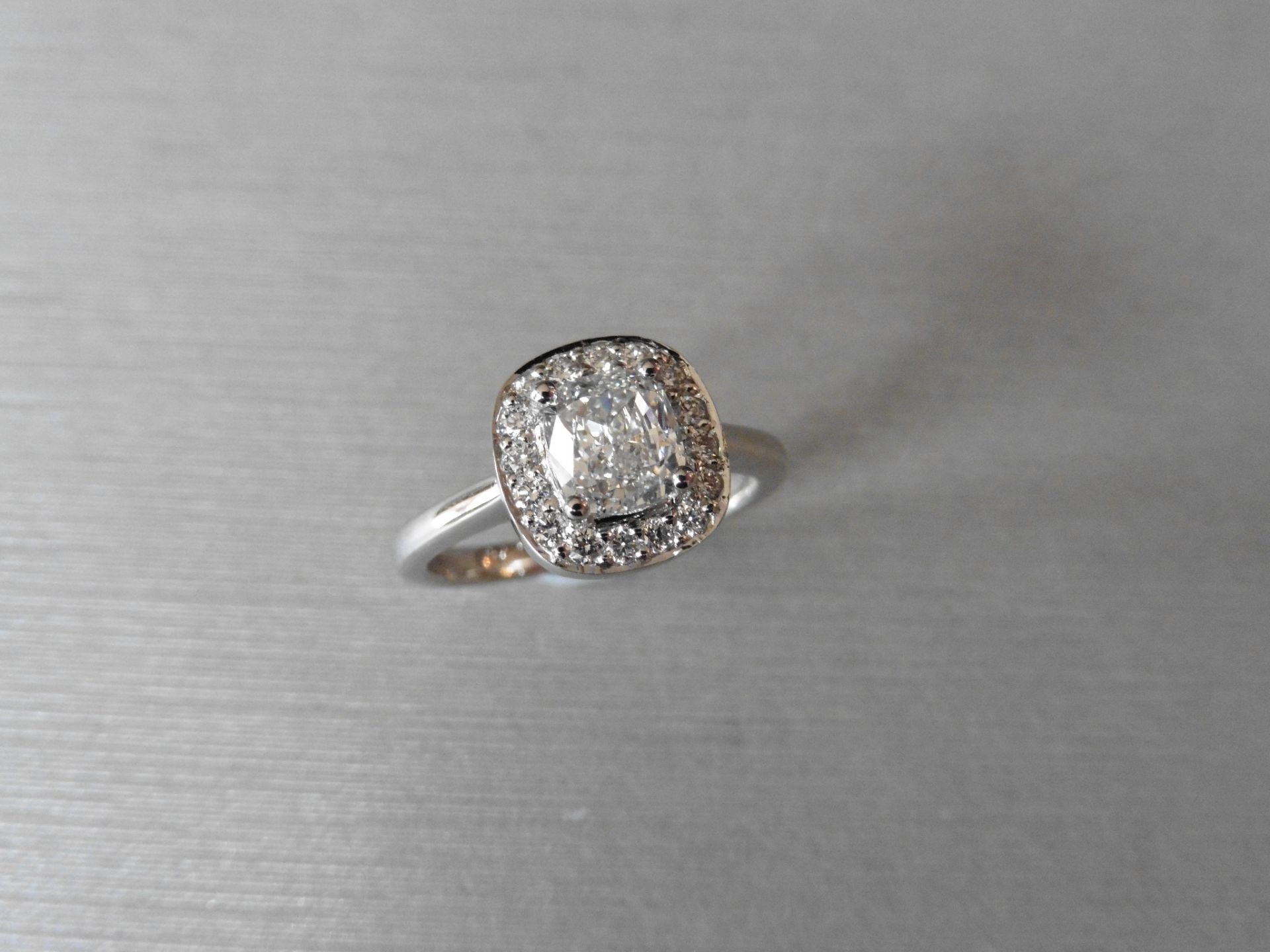 Platinum diamond set solitaire ring set with a 1.20ct cushion cut diamond, D colour and VS2 clarity.