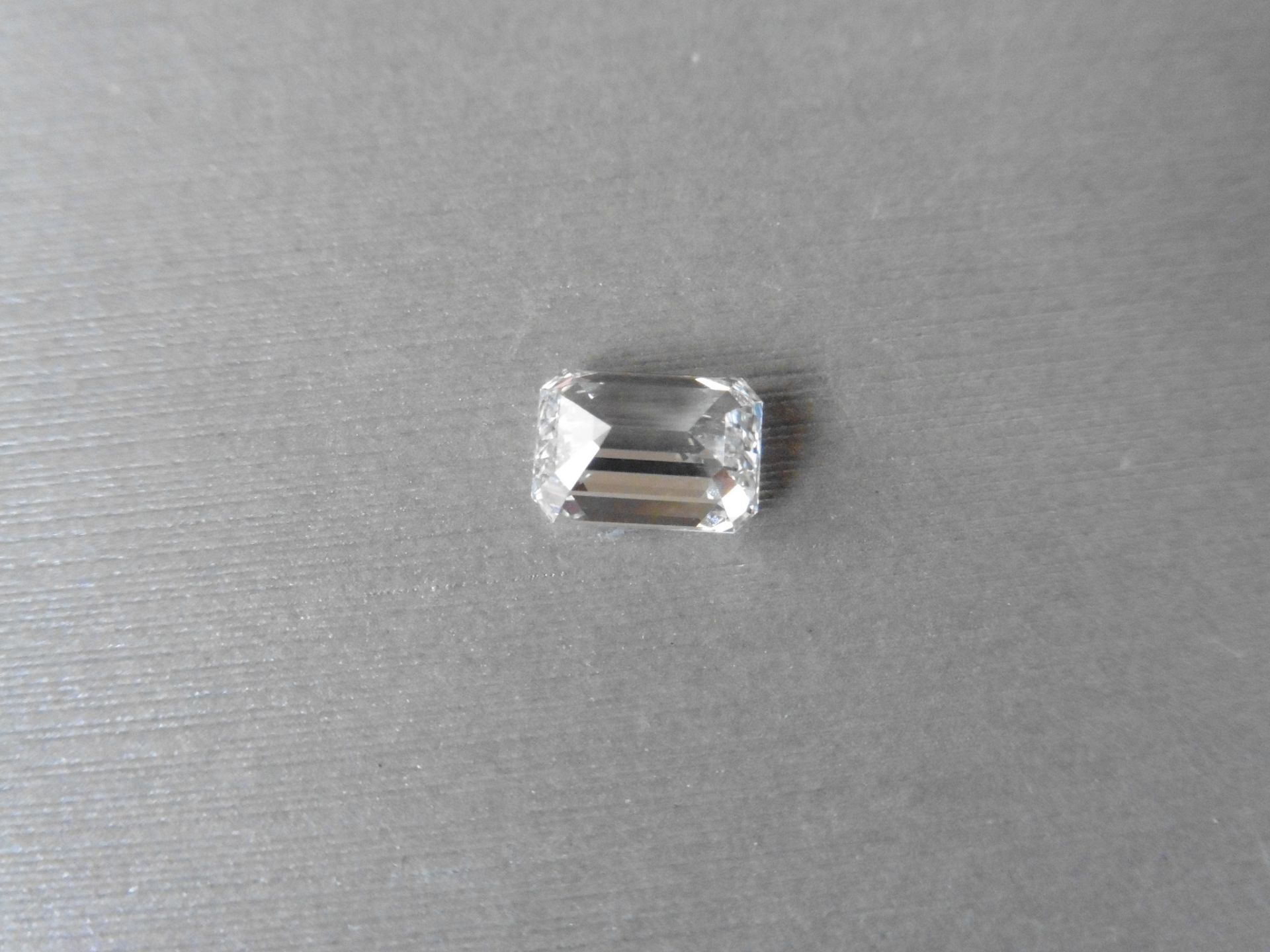 2.00ct single emerald cut diamond. Measures 8.46 x 6.01 x 3.94mm. E colour VS1 clarity. Valued at £ - Image 5 of 7