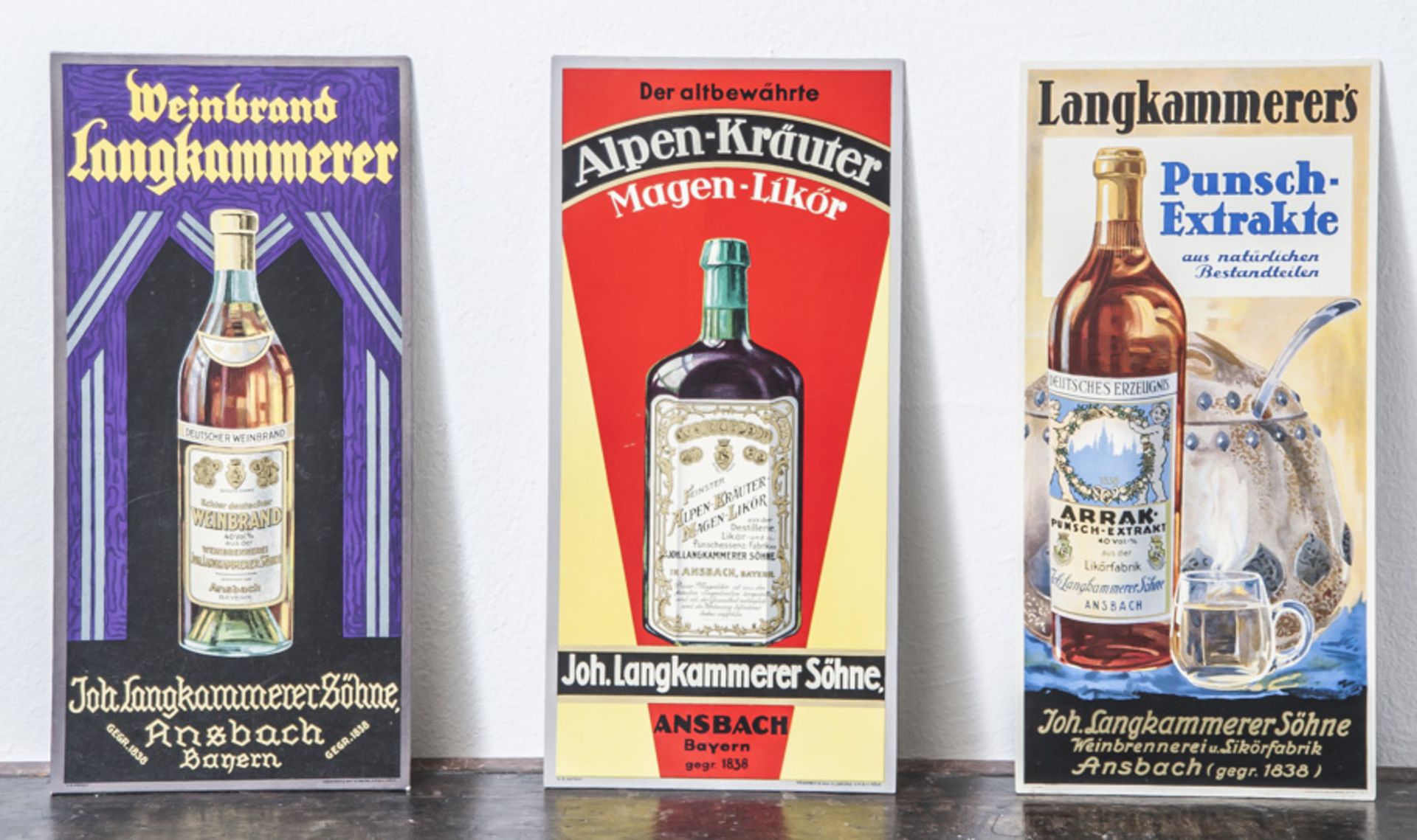 3 Werbeschilder, "Langkammerer's Punsch-Extrakte, Weinbrand Langkammerer" u. "Deraltbewährte Alpen-