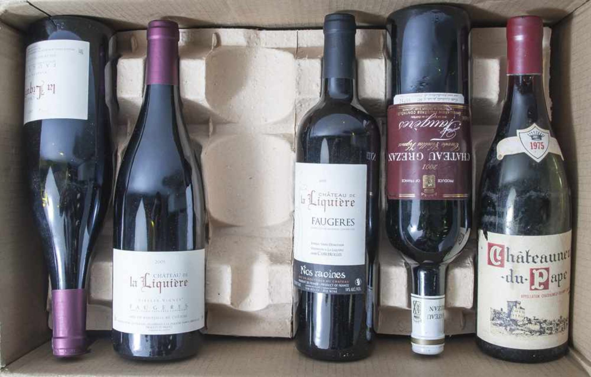 Konvolut von 12 Weinflaschen, darunter: a) 5x wohl 1975er Château de la Liquière Coteauxdu