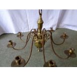 An eight branch brass chandelier