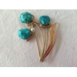 A Gold and Turquoise Broach