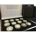 Complete set of 24 Queen Mother silver coins CoA in wooden case (748)