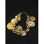 Gold charm bracelet with assorted charms total weight 46 g