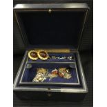A blue leather jewellery box containing a range of, gold silver jewellery to include necklaces,