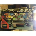 An ATARI boxed super system with games.