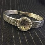 A Vintage ladies Omega watch with diamonds and set in