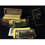 A stereoscope with a box of slides of global slides including Tasmania, Paris, London, Nagasaki etc