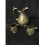 Three pewter jugs