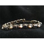 18ct gold, sapphire and pearl bracelet, total weight 29g