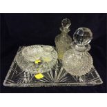 Glass dressing table set to include: three bottles with stoppers, two dishes and a tray