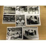 Eight 1960's Formula 1 photographs featuring Graham Hill, Jackie Stewart, Jack Brabham, and Jim