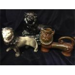 A selection of three ceramic lions