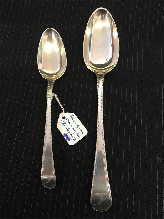 A silver dessert spoon, London 1780 by George Smith and a serving spoon