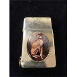 A silver lighter hallmarked Birmingham 1909 with an enamel of lurcher or greyhound, marked with a