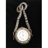 An art deco gold and diamond lady's lapel watch
