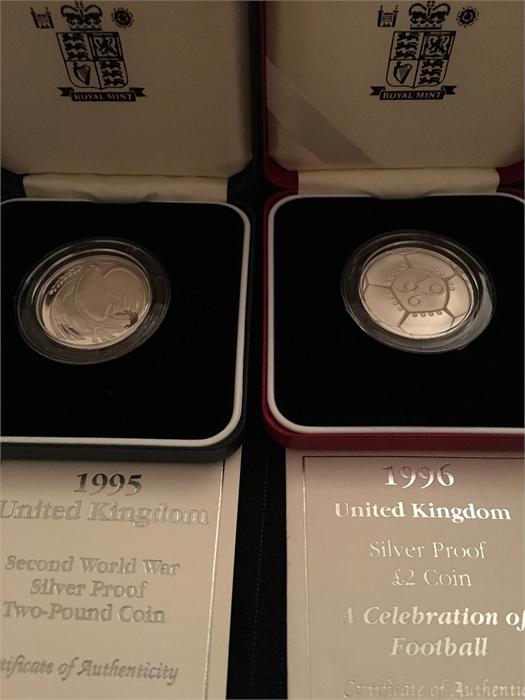 A 1995 Second World War silver proof two pound coin and a 1996 silver proof two pound coin