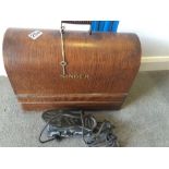 Classic Singer sewing machine, complete and with case.
