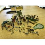 A selection of lead toys to include farmyard animals, people, farm equipment etc by Britains.