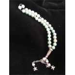 A jade and white metal worry beads