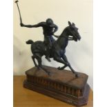 A Bronze of a Polo player on a wooden plinth