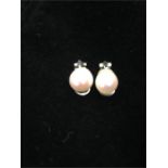 A pair of white gold (750) pearl earrings.