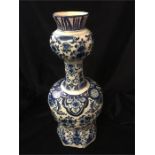 An 18th century delft onion necked vase, with some restoration.