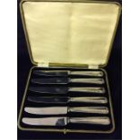Boxed set of six silver handled butter knives. Marked Sheffield 1939