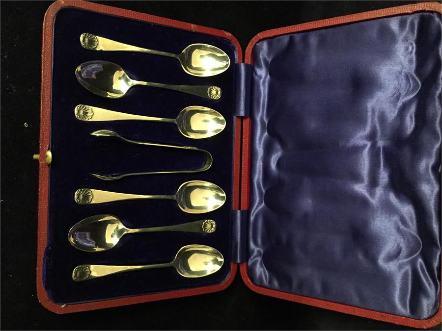 Boxed set of six matching silver teaspoons and sugar nips by James Deakin & Sons - John & William