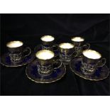 Six Hallmarked silver coffee cup holders, with Aynsley ceramic cups.