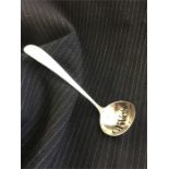 A silver Olive spoon