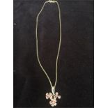 A hallmarked 18ct (750) necklace with pink sapphire and diamond pendant