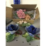 A pair of ceramic rose shaped candlesticks and five further capodimonte pieces