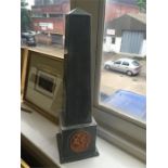 A ceramic obelisk