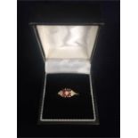 An antique ring set with rubies and diamonds