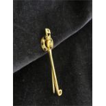 A 9ct gold horseshoe lapel pin with diamond and sapphire 2.5g total weight.