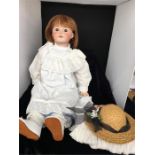 Sfbj 25 inch collector's bisque headed doll. Brown eyes original wig.Fully jointed composition body,